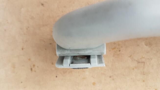 VW GOLF III UCHWYT RĄCZKA PODSUFITKI 1H0857607