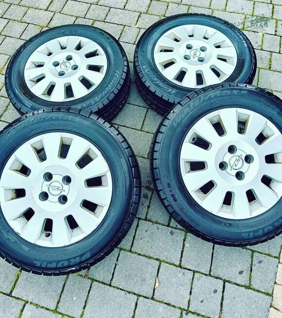 Felgi aluminiowe 15” + opony zimowe Opel 4x100 – komplet