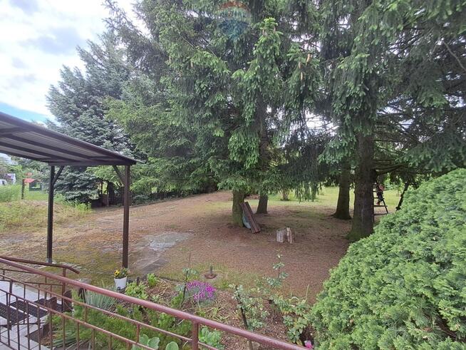 Działka budowlana 2100 m2 z domem. Zakręt