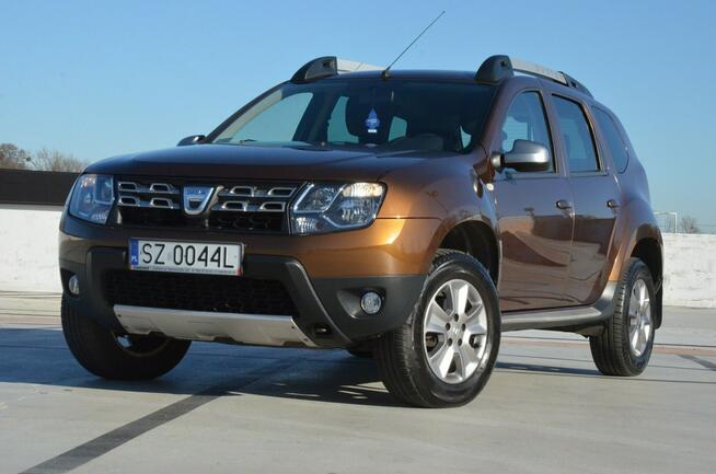 Dacia Duster 1.6i 105 KM Klima/ Navi/ Alu/ Ele. szyby/ Relingi/ Krajowy