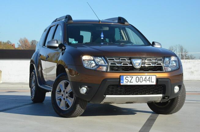 Dacia Duster 1.6i 105 KM Klima/ Navi/ Alu/ Ele. szyby/ Relingi/ Krajowy
