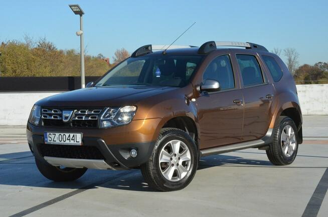 Dacia Duster 1.6i 105 KM Klima/ Navi/ Alu/ Ele. szyby/ Relingi/ Krajowy