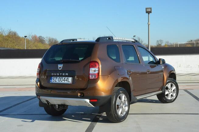 Dacia Duster 1.6i 105 KM Klima/ Navi/ Alu/ Ele. szyby/ Relingi/ Krajowy