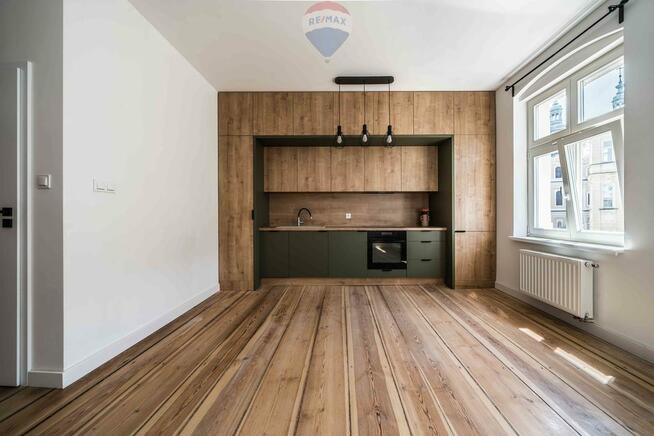 Ładna kawalerka kamienica winda Stare Miasto