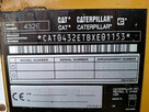 Koparko ladowarka Caterpillar - 15