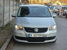 Volkswagen Touran Super Stan. Super Wyposażenie PRZEBIEG: 159.814 Bezwypadkowy GWARANCJA - 2
