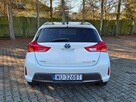 Toyota Auris 1.8 Benzyna Hybryda 136km Automat Biała Perła - 10