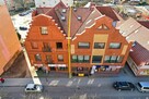 * Budynek mieszkalno-usługowy w centrum Olecka *