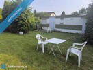Działka ROD z przyczepą nad morzem.