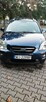 Kia caren III - 7