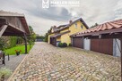 Dom z potencjałem inwestycyjnym – 194 m², pokoje na wynajem, 2 garaże - 2