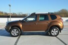 Dacia Duster 1.6i 105 KM Klima/ Navi/ Alu/ Ele. szyby/ Relingi/ Krajowy - 12